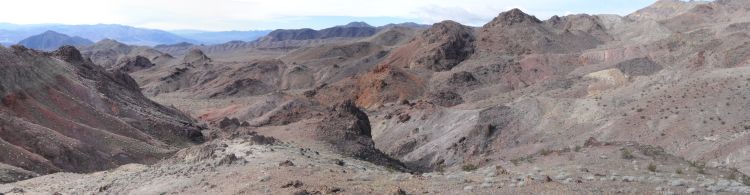 Panoramic of colorful badlands below Epaulet Peak