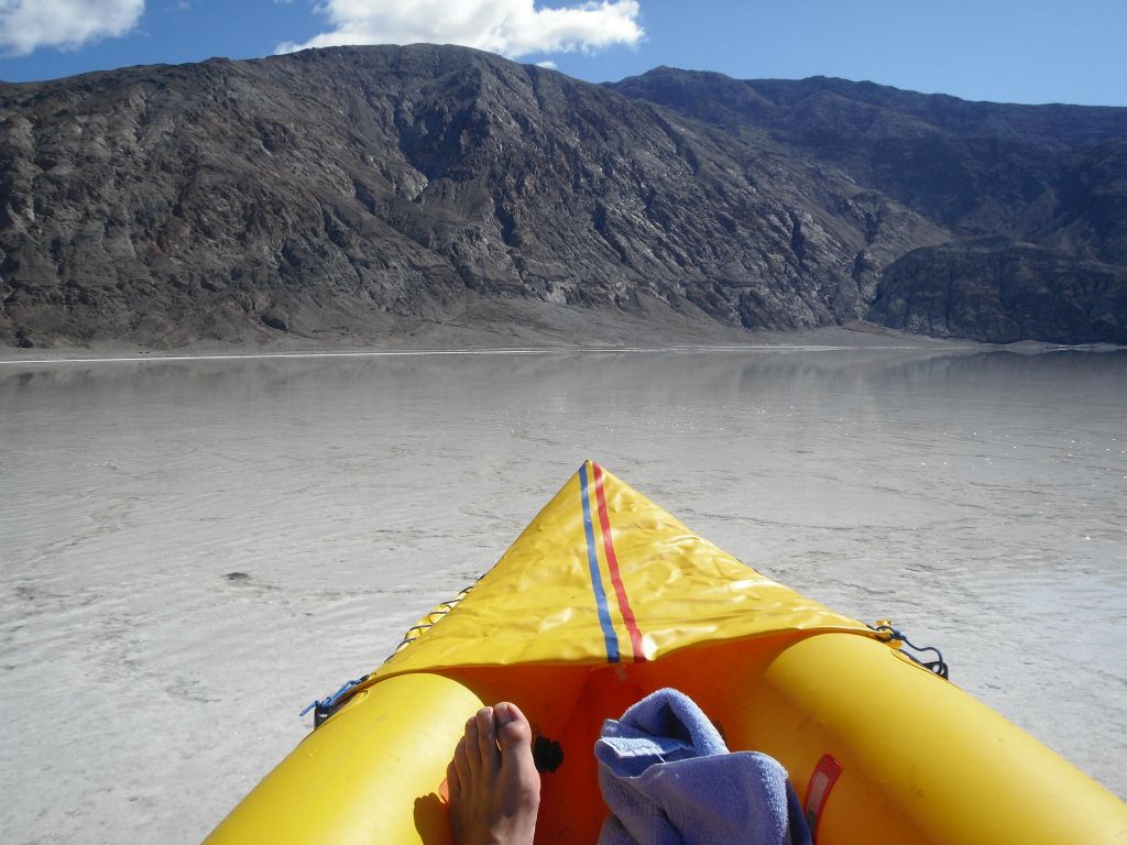 View from the kayak as visible waves rippled across the lake caused by the kayak's movement: