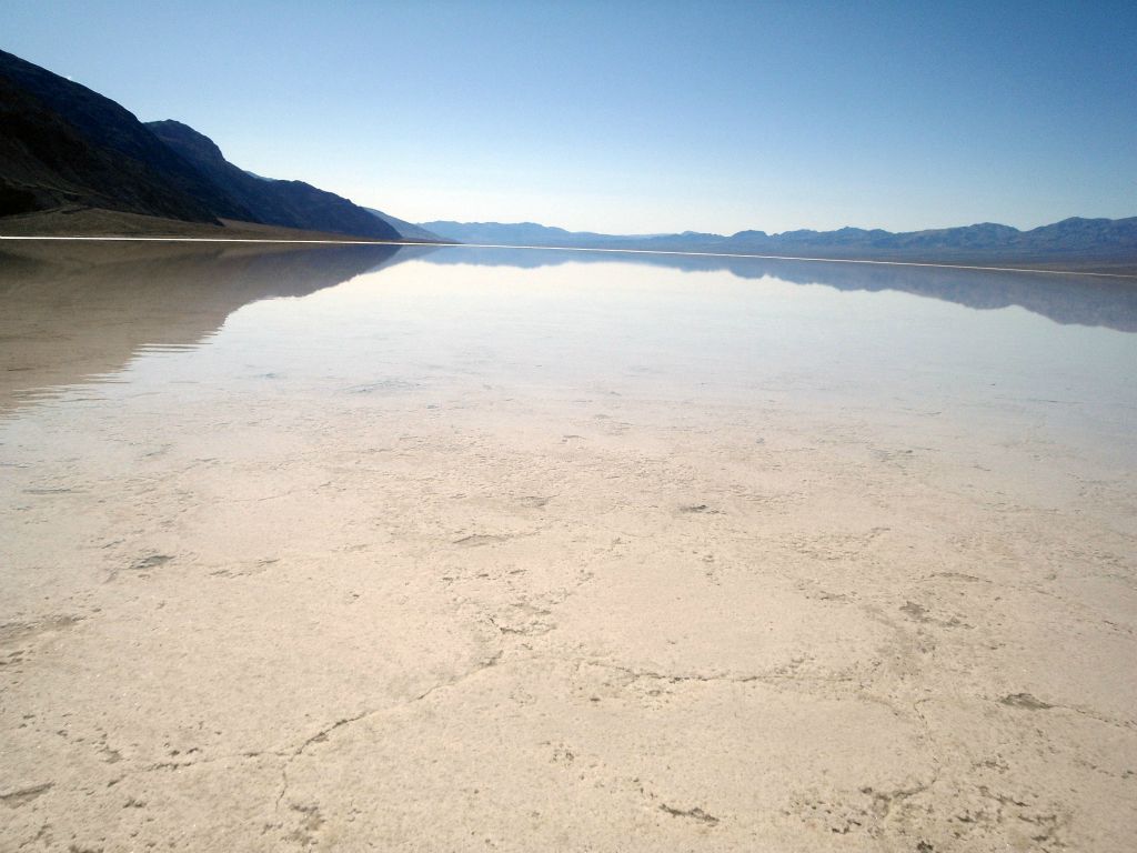 Once the water started getting deeper, I left my hiking boots behind on the shoreline and waded out into the salty water with bare feet: