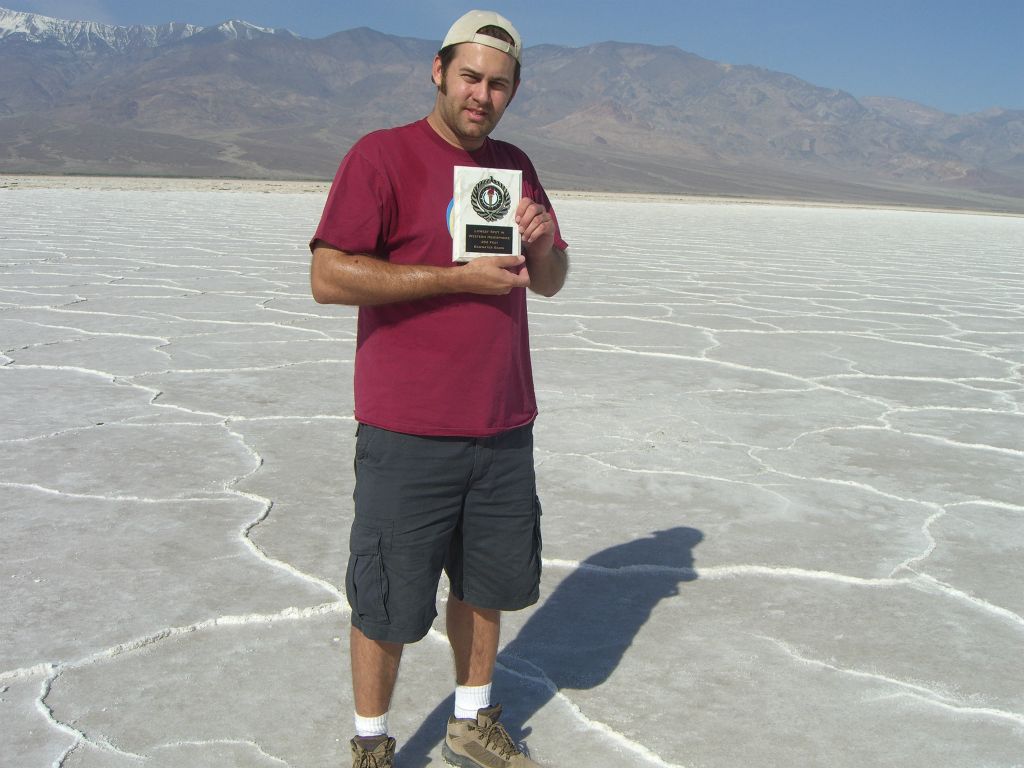Getting a picture while holding the Lowest Point plaque: