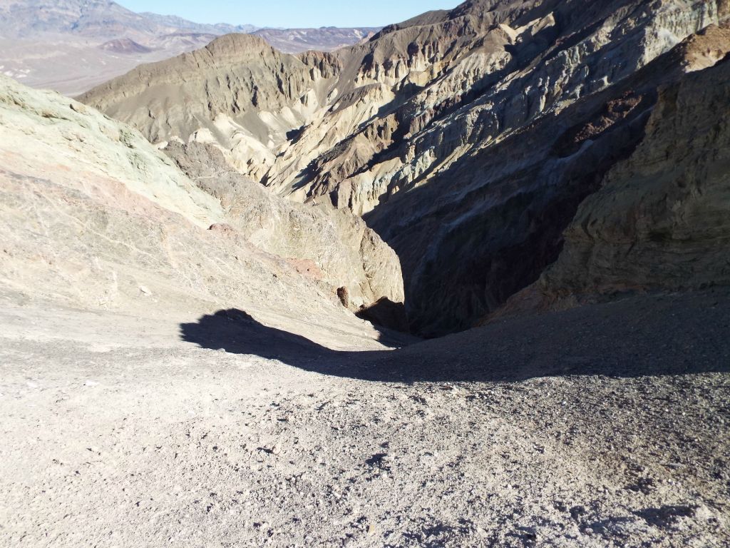 In the first picture, we are standing on the ridge high above Corkscrew Canyon looking at this very tempting drop-in route which heads into the canyon: