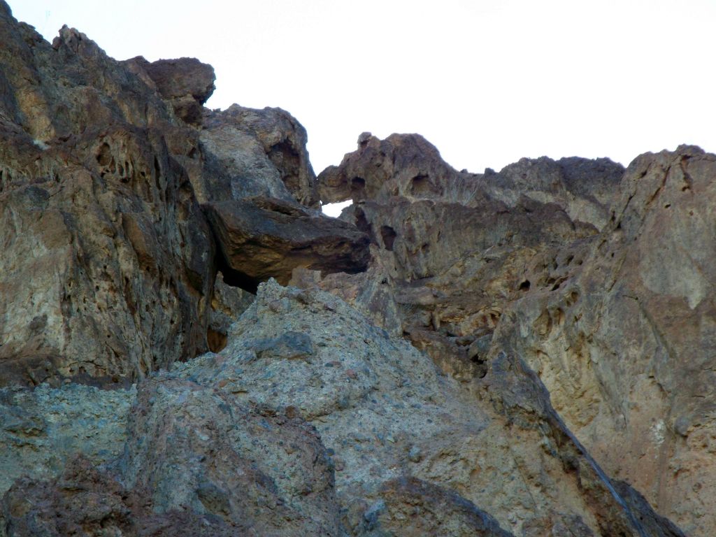 Zooming in on a natural window (or arch) that was visible on the ridge above the canyon headwall: