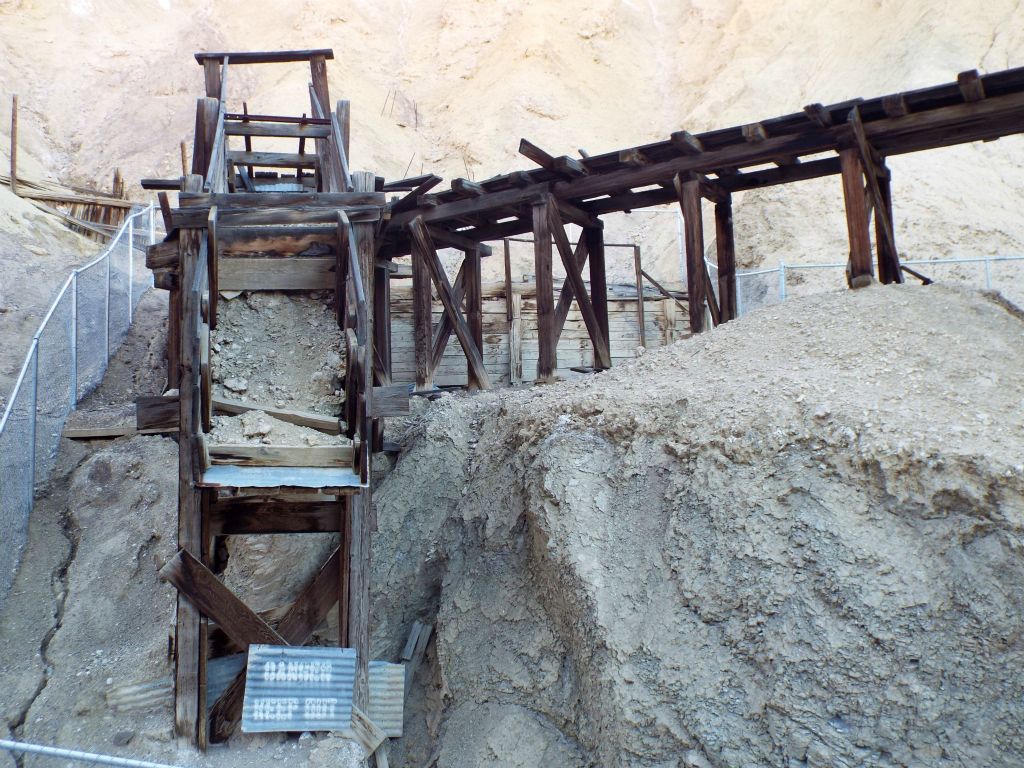 Ore can be crushed, sorted, and processed after it has been dumped at the top: