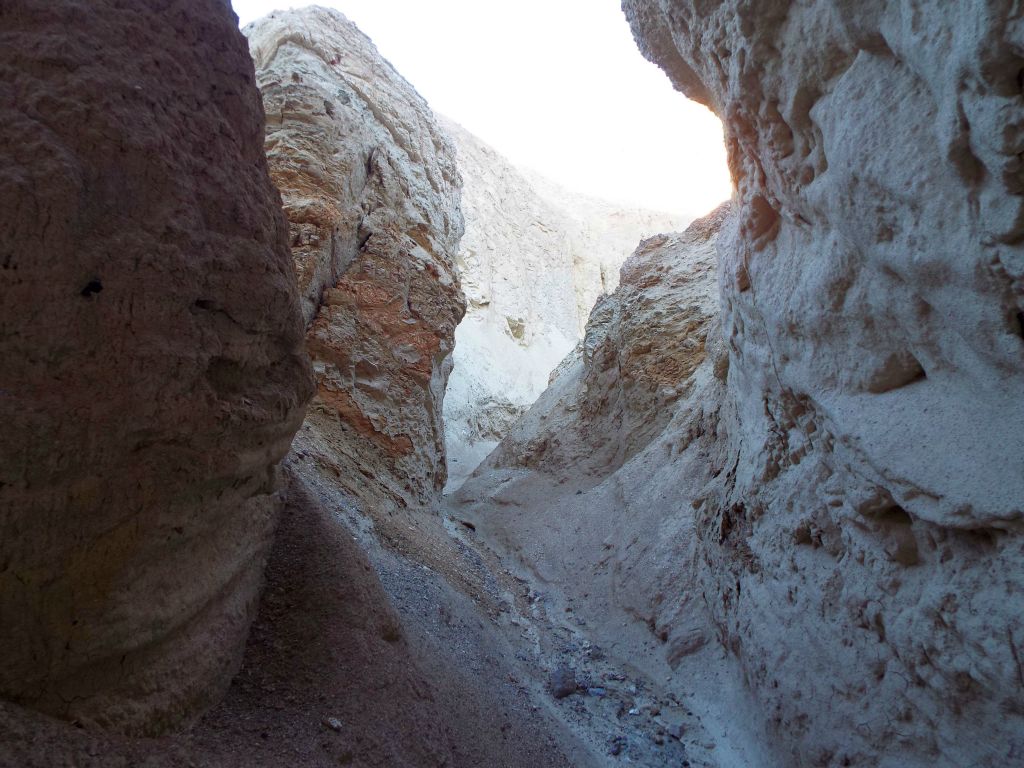 Rounded blocks of canyon walls push out on both sides: