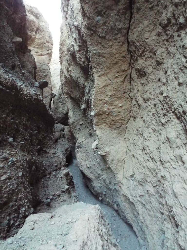Standing up on top of the giant boulders for a view of the canyon: