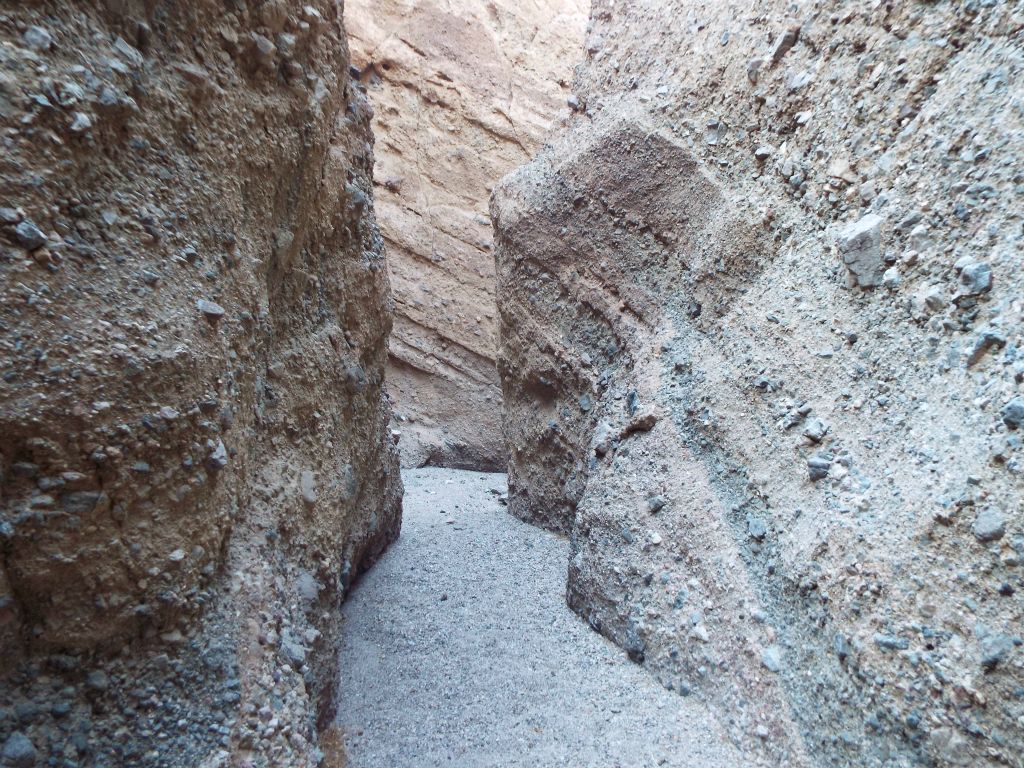 Patterns rising from the wash and uplifting along the canyon walls: