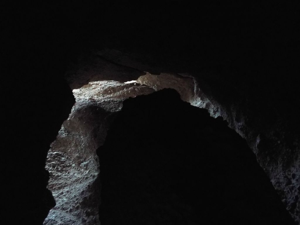 Looking up at the immense dark cavern above me in the slot: