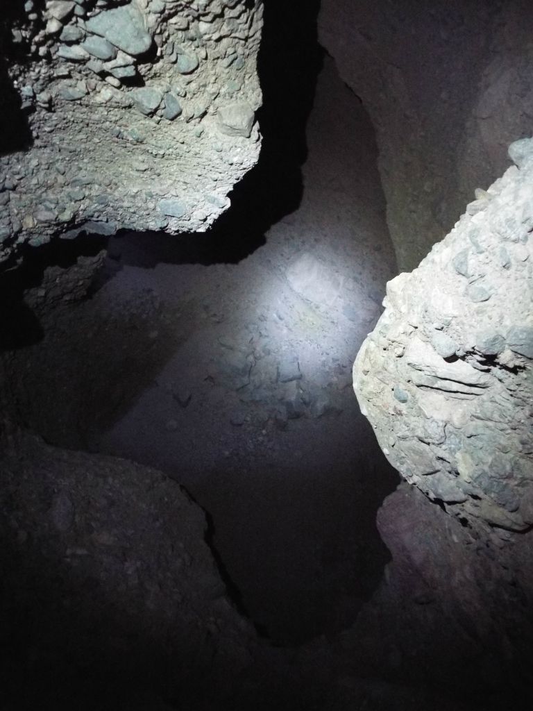 The accessible slot ended at the top of this major dry fall.  Hikers down below would be able to see the spot where I am now standing, but they would not be able to safely climb up to it without considerable risk:
