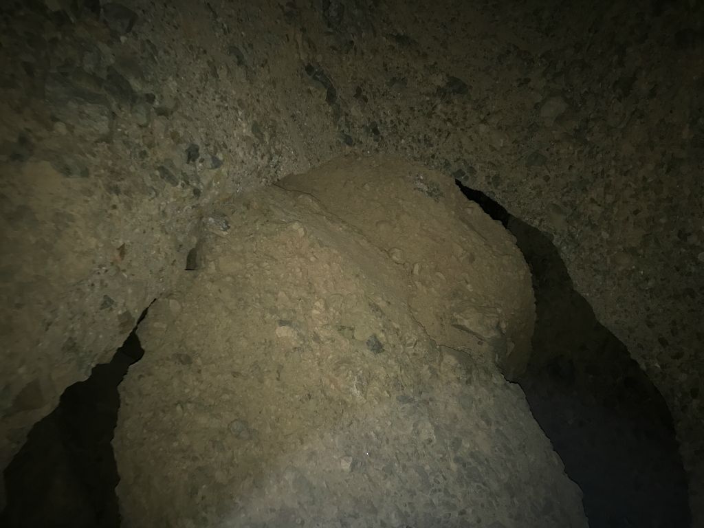 Two pictures looking up at the central portion of the bridge.  There is a giant boulder directly behind the bridge which is not connected to it: