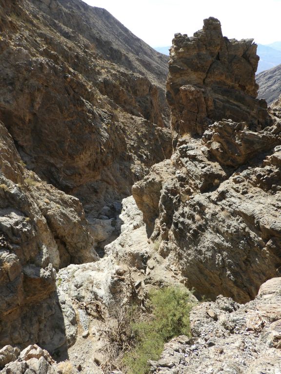 An incredible view looking down canyon from the spring with a large rock pinnacle rising up above on the right side: