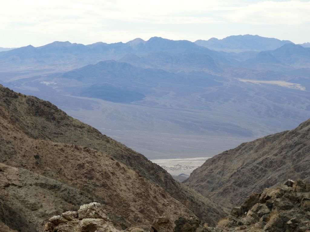 The view looking out the canyon is really spectacular as it shows three major Death Valley peaks.  Left to right, they are Sugarloaf Peak, Needle Peak, and Manly Peak: