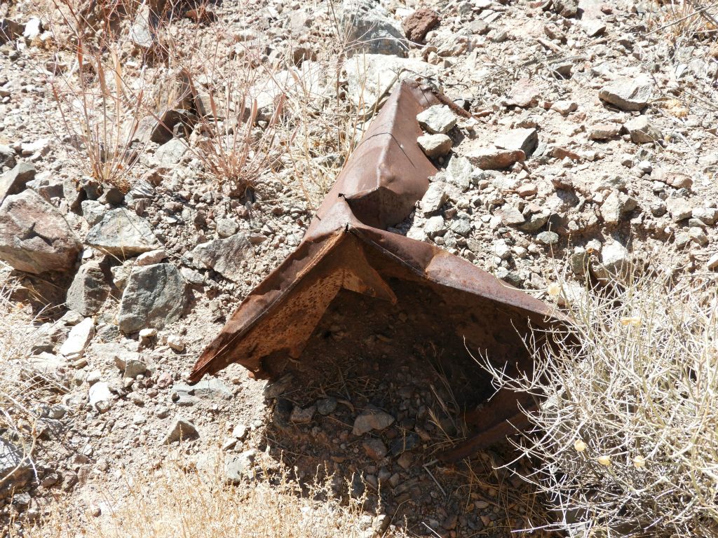 An old relic of mining days that is becoming fully buried in the wash: