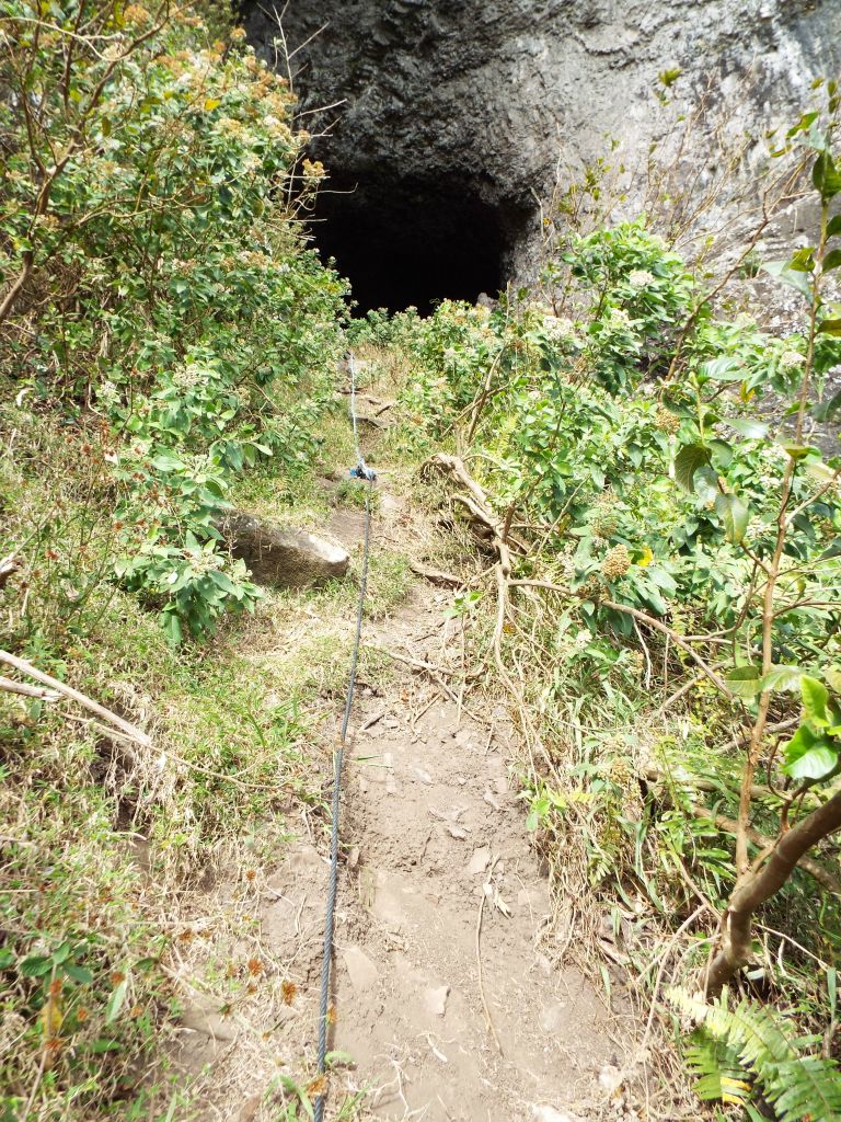 Last section of climbing with the rounded cave entrance in sight: