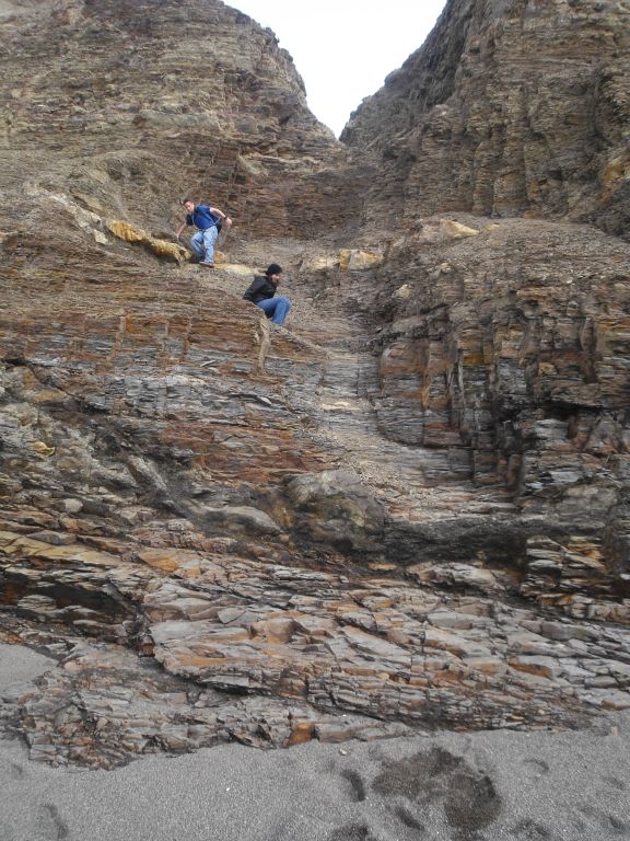 The next two pictures show Annie and Jered carefully working their way down the cliff made up of loose rocks.  Caution is definitely in order here, and anybody who is older, out of shape, or who has bad balance may not be able to safely do this.  According to the NPS, many injuries have occurred at this area: