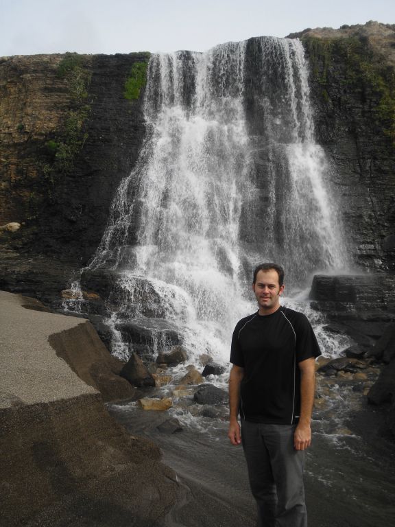 A picture of Steve standing in the run-off corridor where the fresh water of Alamere Falls flows into the salt water of the Pacific: