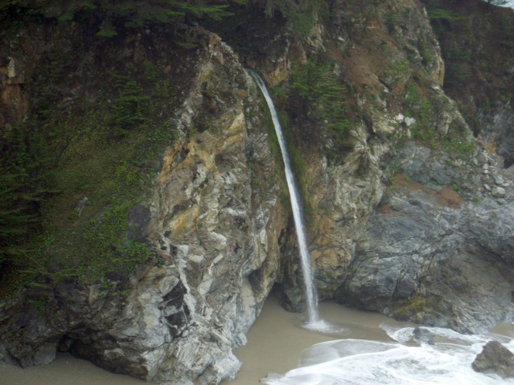 Zooming in on McWay Falls, which plunges 80 feet onto a sandy beach of the Pacific Ocean: