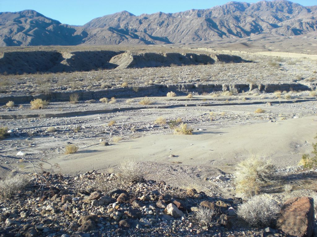 It was a fairly easy hike down into Death Valley wash, with just some ups and downs.  Here we are just entering the wash at the bottom.  In the first photo above, it looks like the easiest route from here is right through the main wash of Bighorn Gorge, but it's actually better to hike on the hillside to the left: