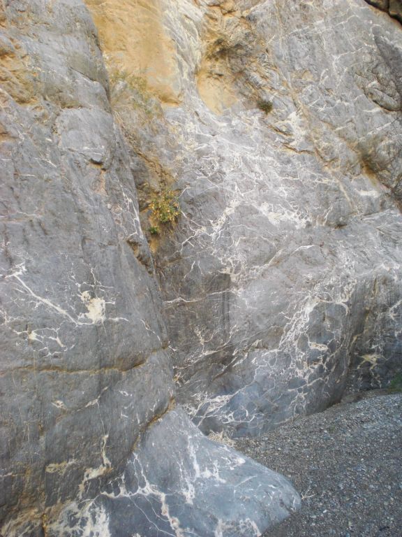 Pretty streaks of white coloring the polished rock walls: