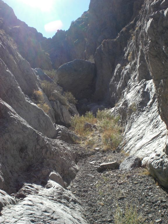 Up ahead, a giant boulder has rolled into the canyon and gotten wedged between the walls: