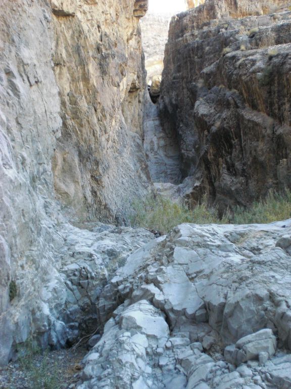Soon we rounded the bend to the left and reached the end of the line for the 1st Narrows.  Looking up from here, the 60 foot dry fall is in the upper portion of the photo: