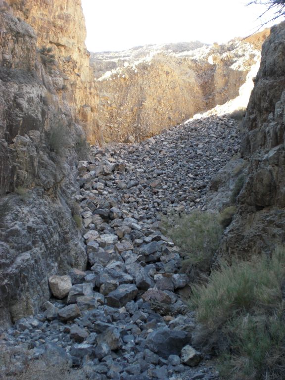 While the others rested some more, I decided to head up the bypass to get above the dry fall.  This photo reveals the slope of boulders I had to scramble up: