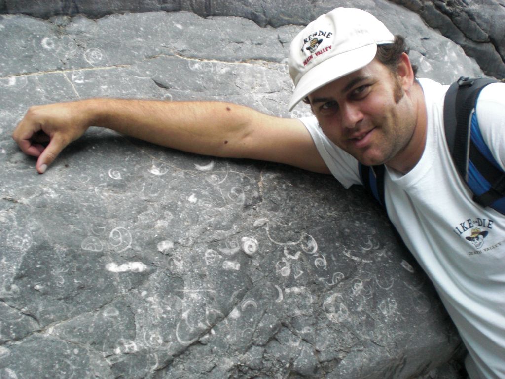Steve getting his picture by a wall of fossils back in the 4th Narrows: