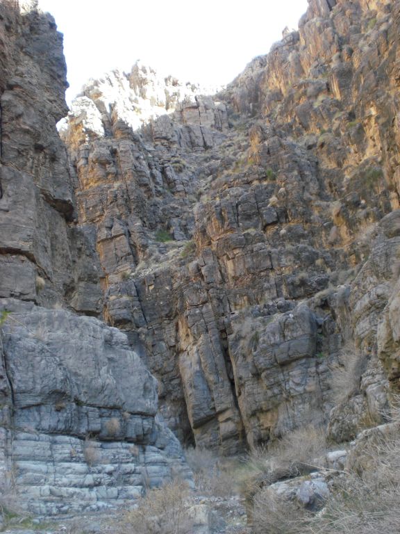 Very high canyon walls with no way in or out of the canyon through here: