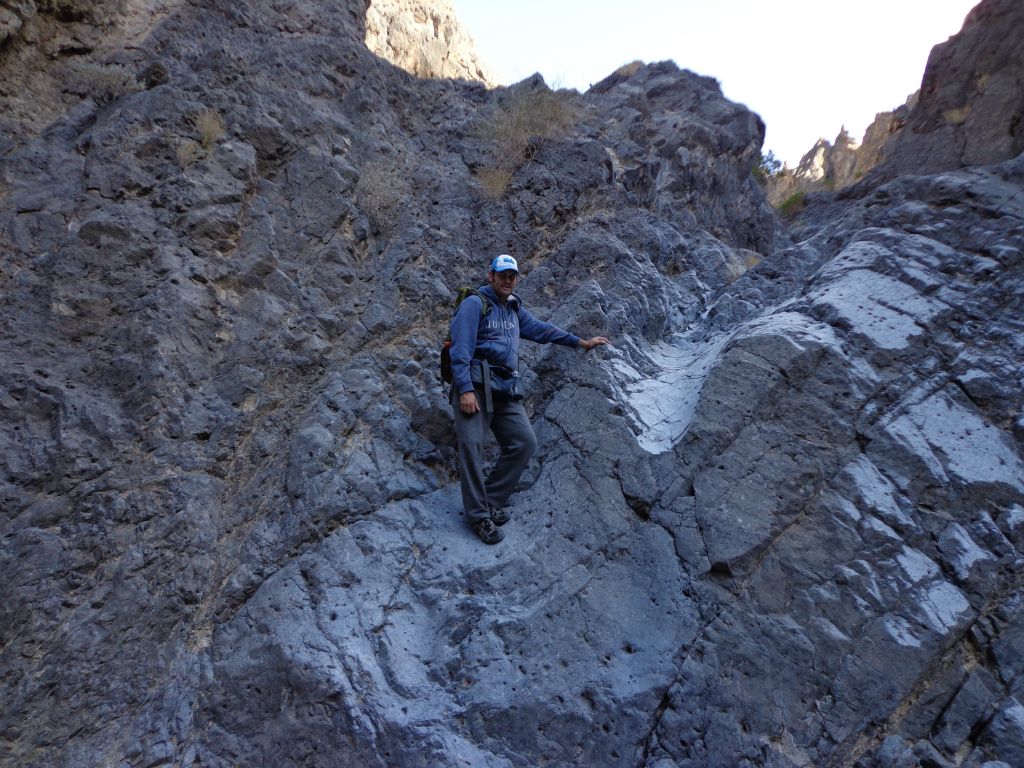 Climbing the dry fall in order to see what is farther up canyon: