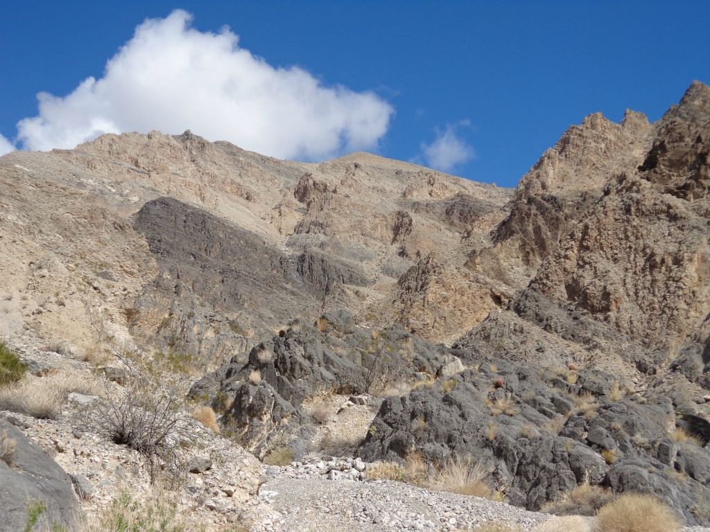 A mixture of rock types and colors on the surrounding hillsides: