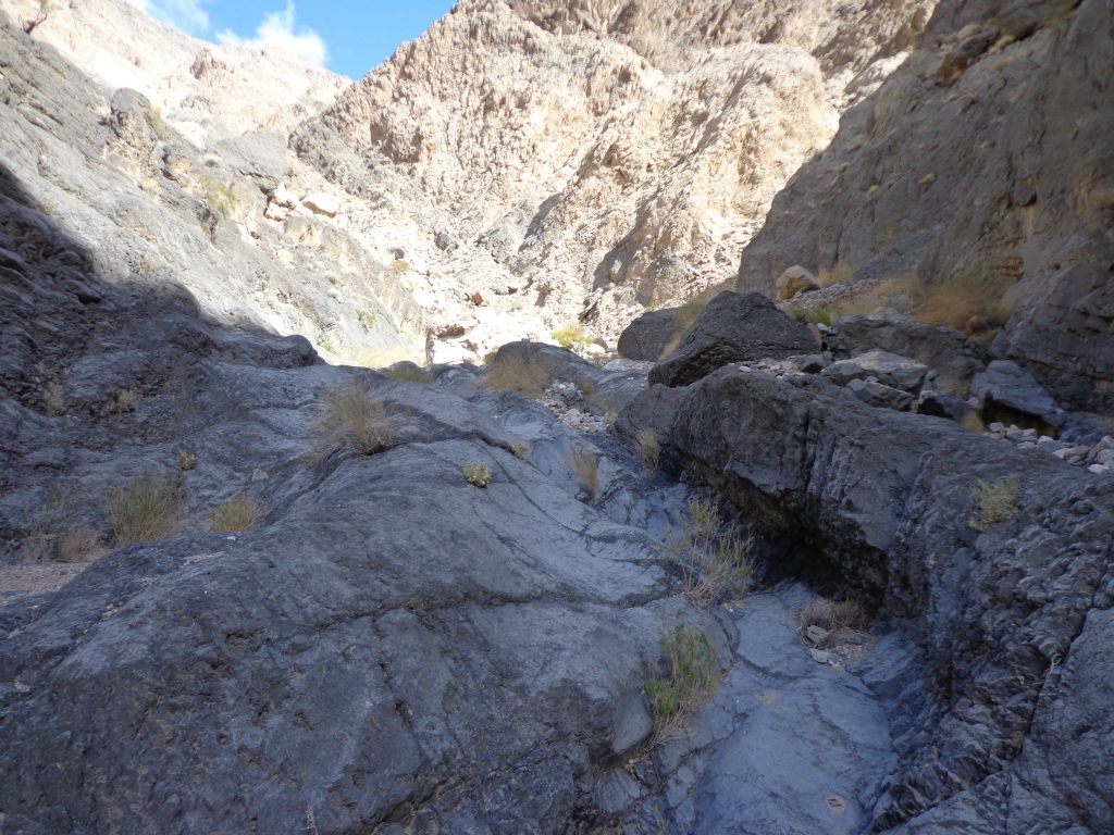 Walking up a small chute in the middle of the canyon as things really narrowed down: