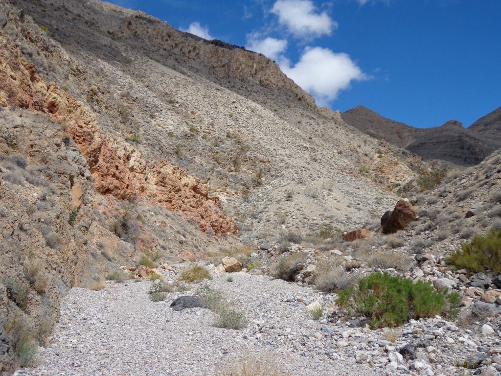 More dirt hillsides dropping into the wash as we continued up canyon: