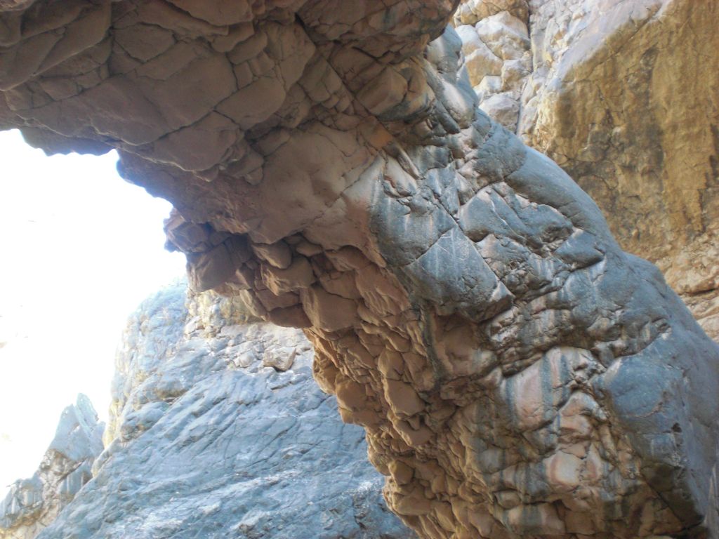 Take a closer look at the bulging rock which makes up the natural bridge: