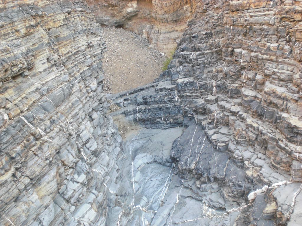 Climbing down some rock steps which were part of a minor dry fall: