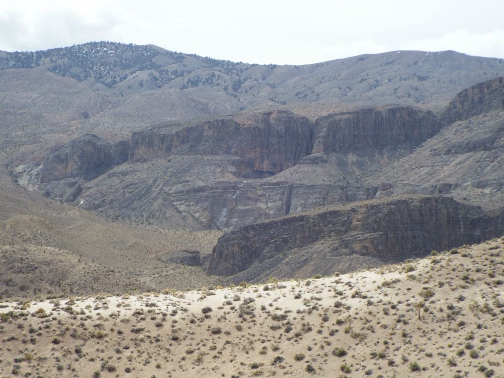 Three sets of high cliffs are visible in the distance.  Lost Canyon is located near the area of the middle cliffs, but out of view to the right:
