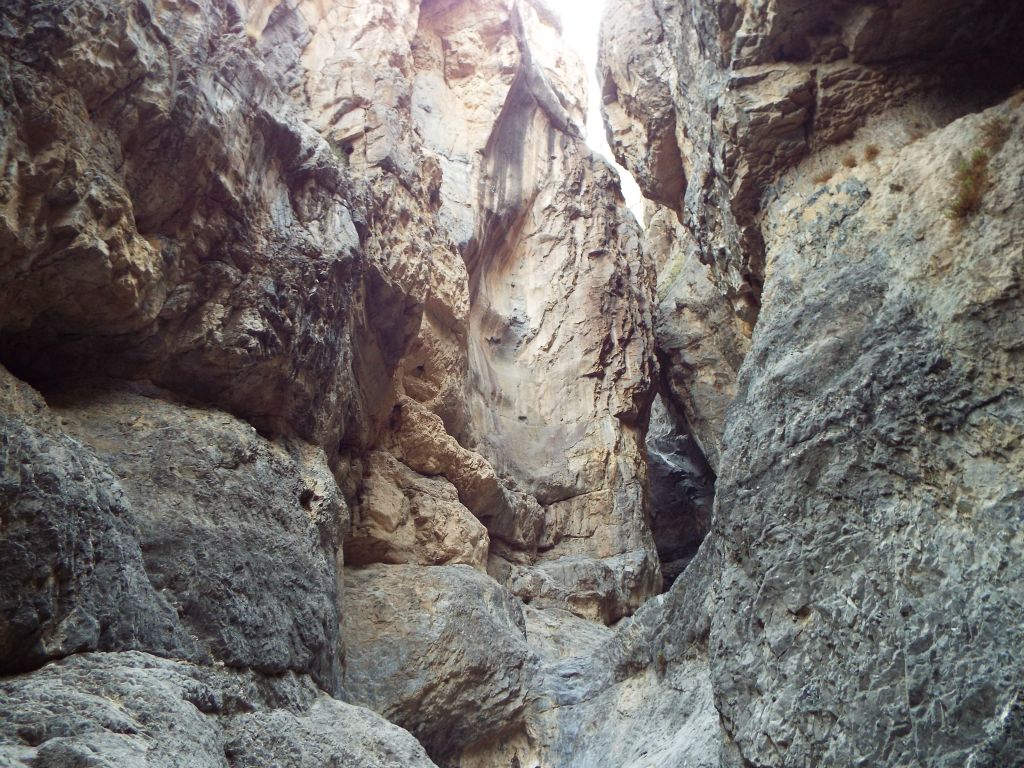 After walking under the boulder, an even more incredible scene reveals itself:
