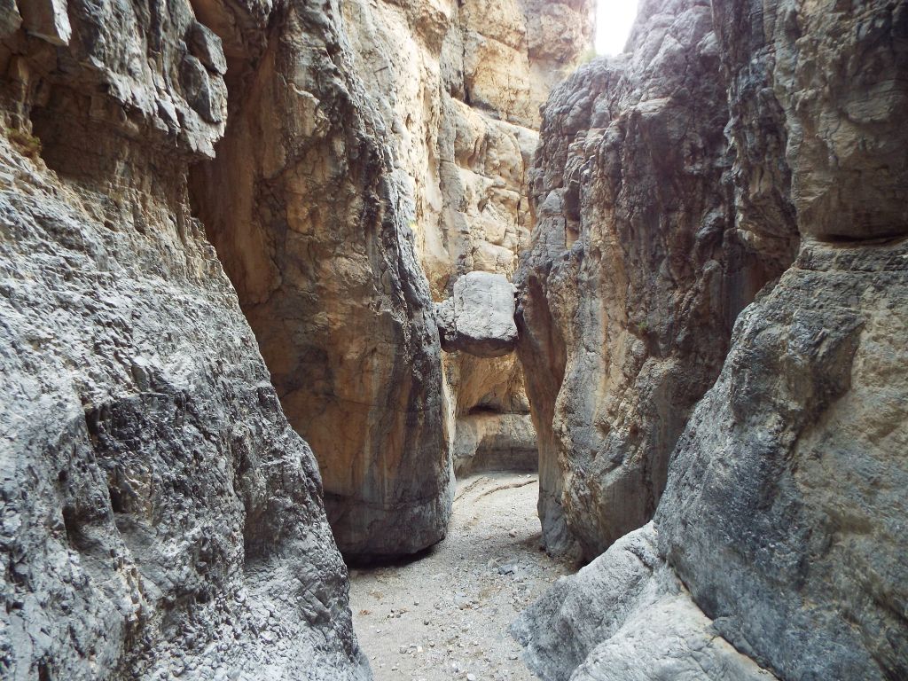 Two more pictures showcasing the wedged boulder taken from behind it: