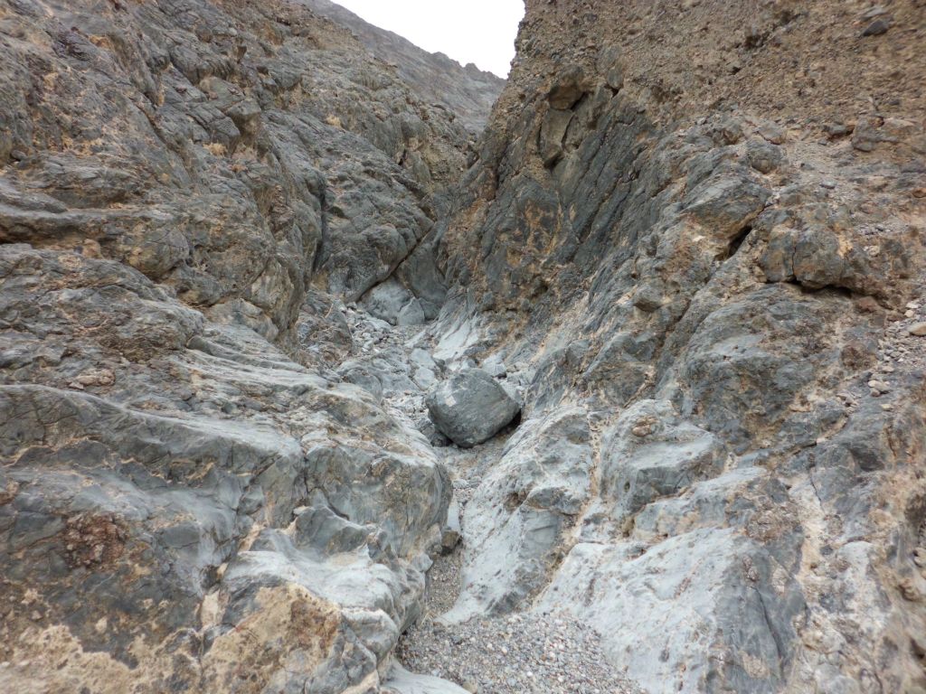 The canyon transitioned from dirt hillsides into solid rock on both sides: