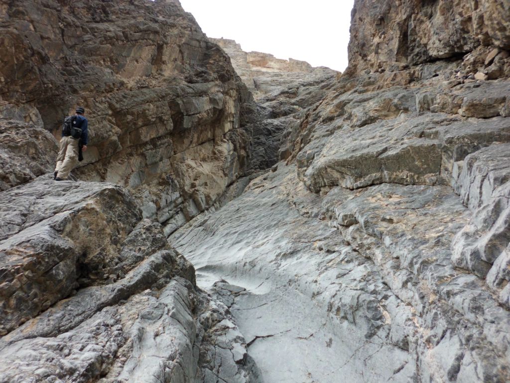 Tobin above the curved dry fall looking ahead: