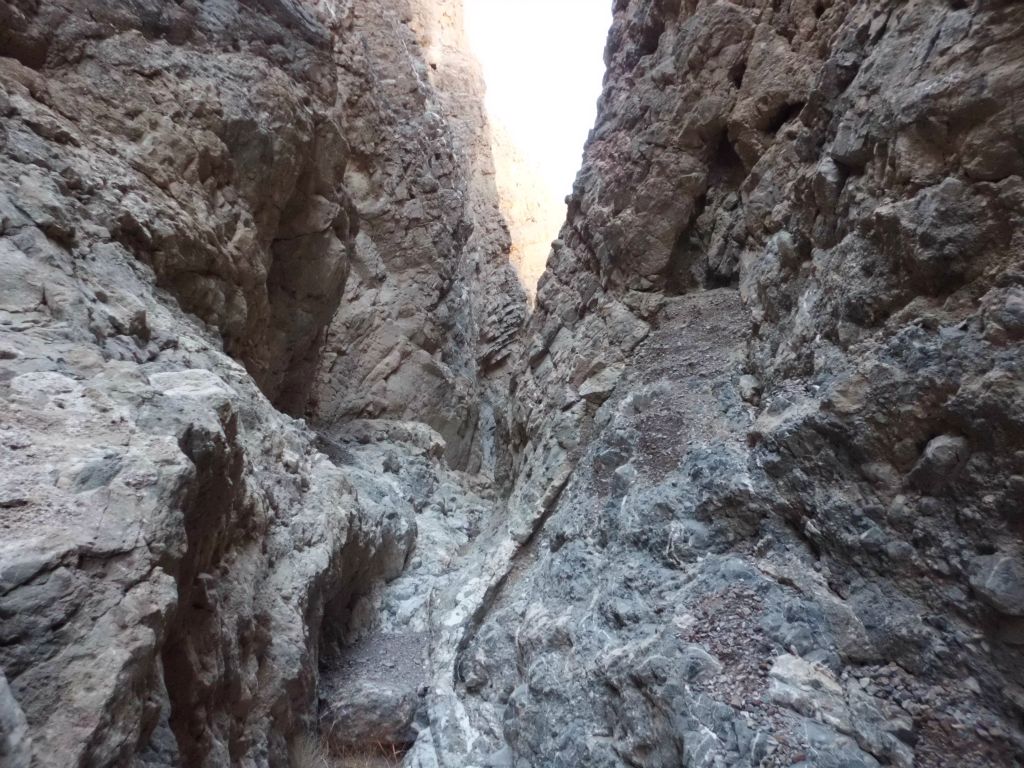 Just a very narrow passage to walk on while passing through the slot: