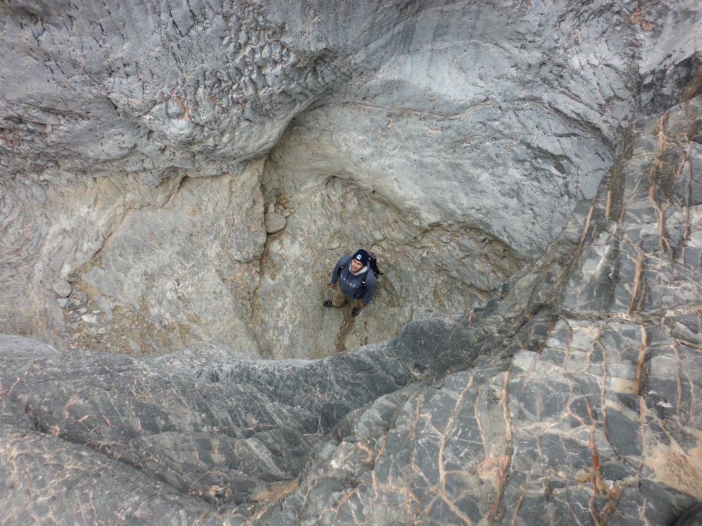 Standing down at the bottom of the plunge pool for a photograph: