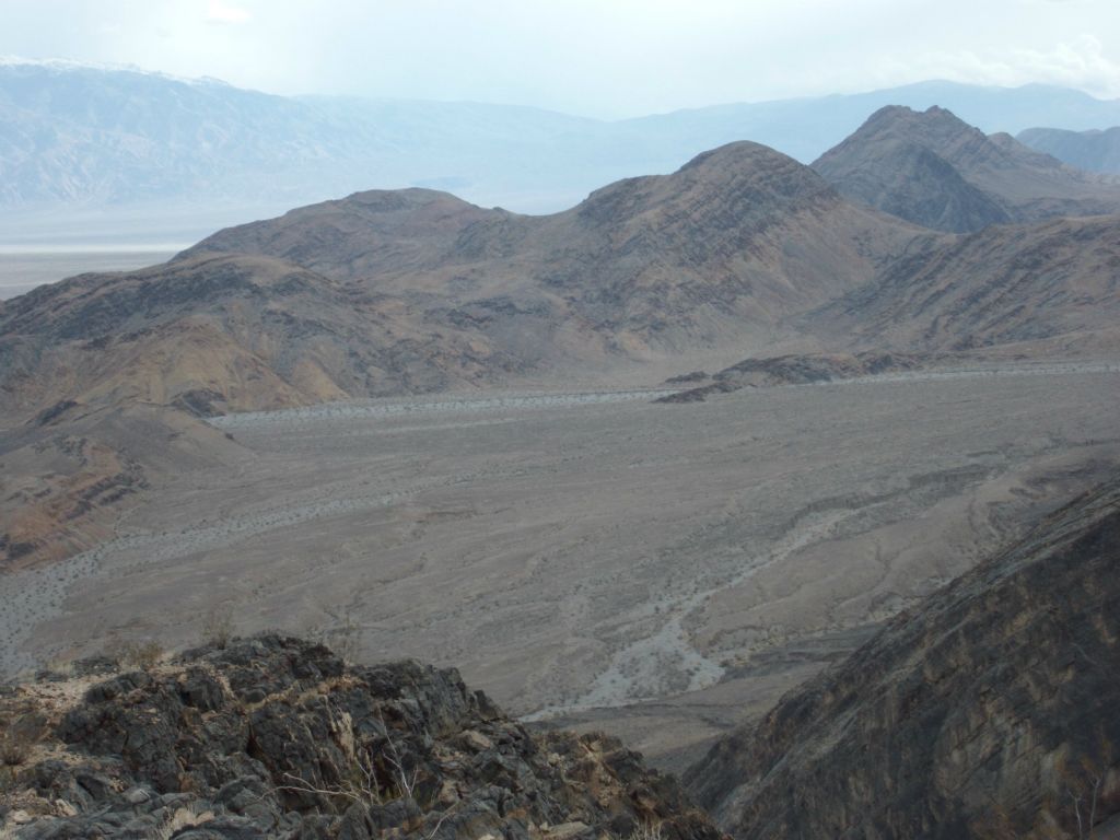 Finally attaining the ridge and looking at the scenery past the canyon mouth: