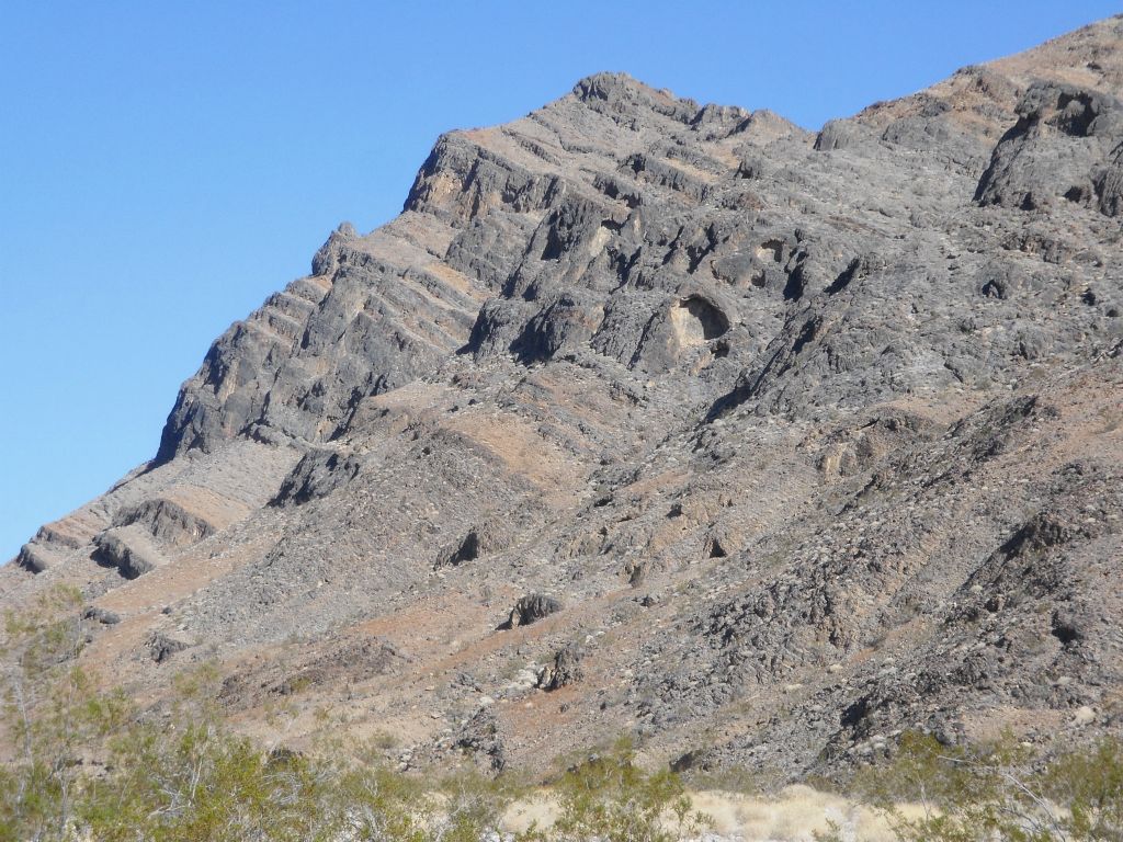 Two pictures of high rocky cliffs which we passed by in the middle area of 5 Mile Rock Canyon: