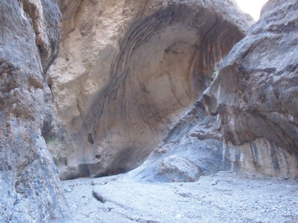 A rounded area on the wall with pretty streaks across the smooth rock: