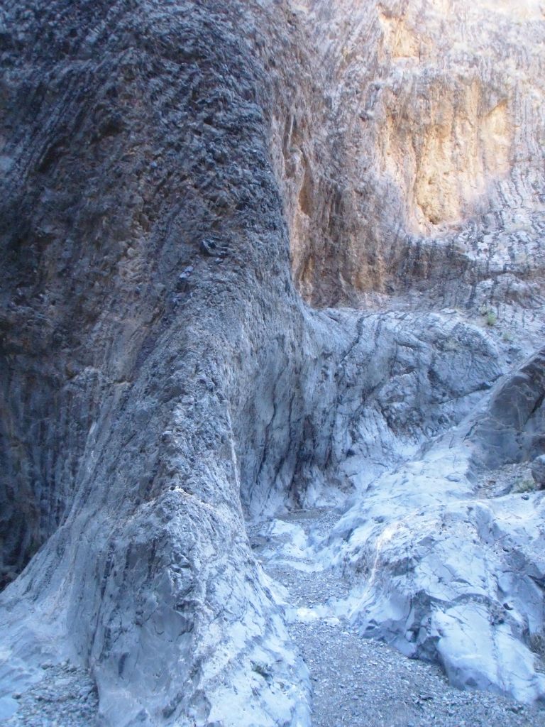 The turquoise glow contrasting with the golden glow of the upper canyon walls: