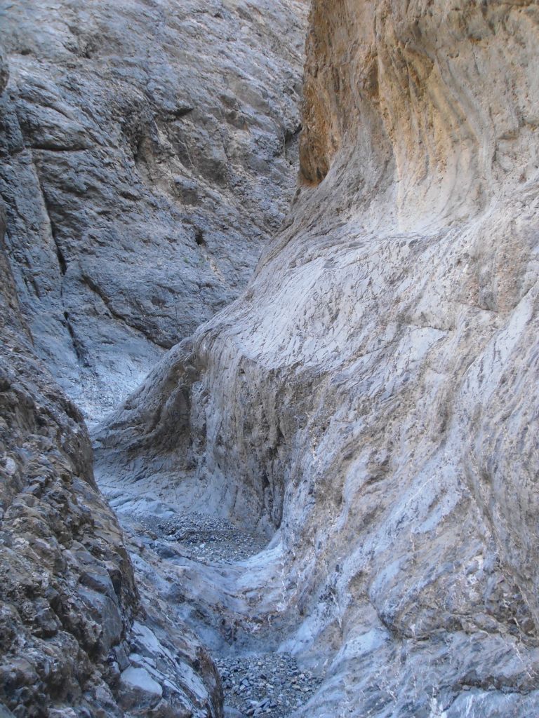 Notice the surface of the ground we were walking on.  Sometimes gravel and sometimes solid rock connecting the two sides of the canyon: