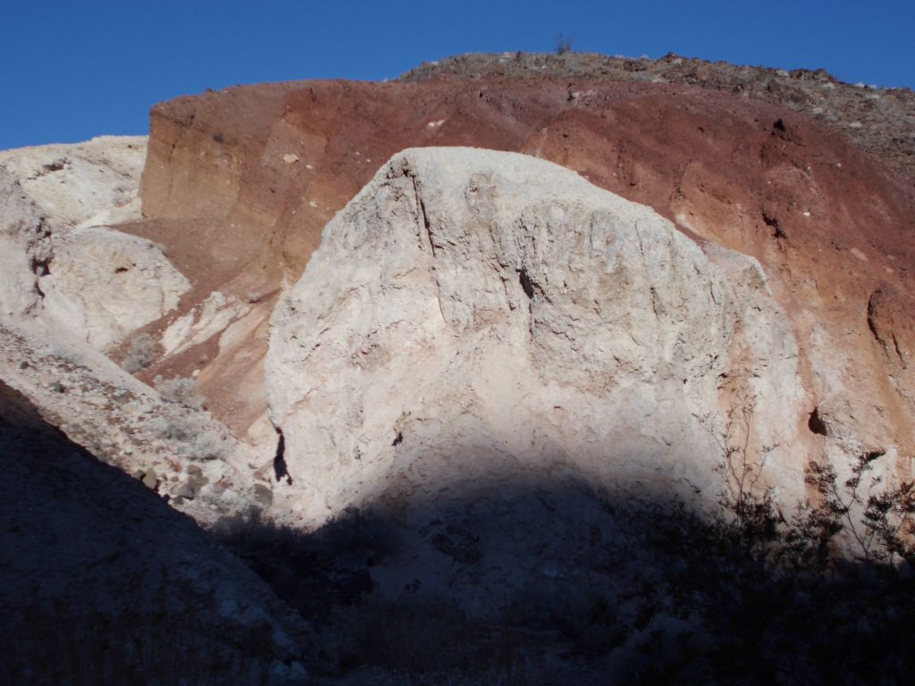 A blend of white and red colors powdered the surface of this hillside: