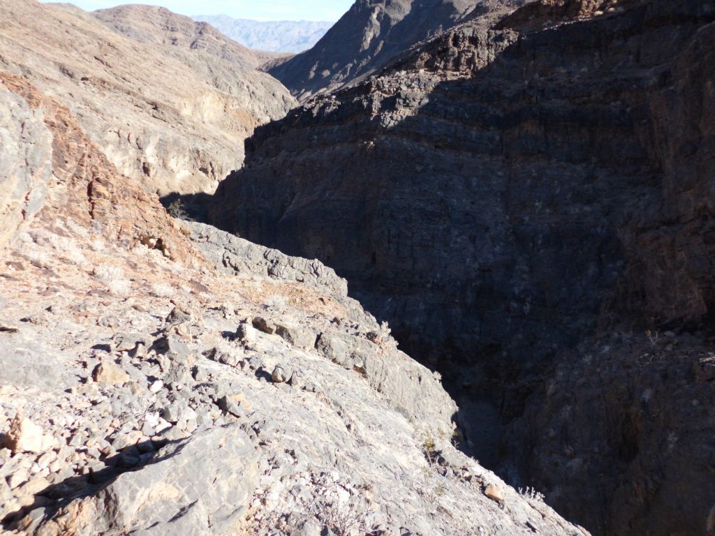 We had no choice but to bypass that last dry fall.  Now we are up above the canyon looking down into it: