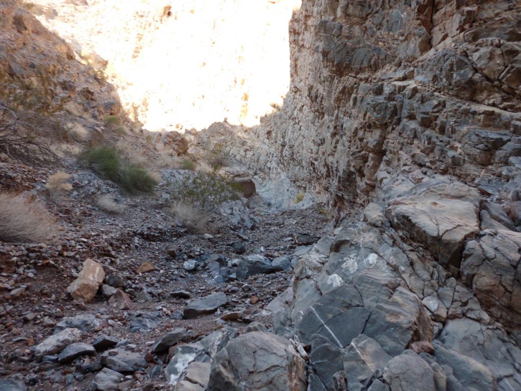 Reaching the canyon floor in the middle of some nice narrows and heading down canyon: