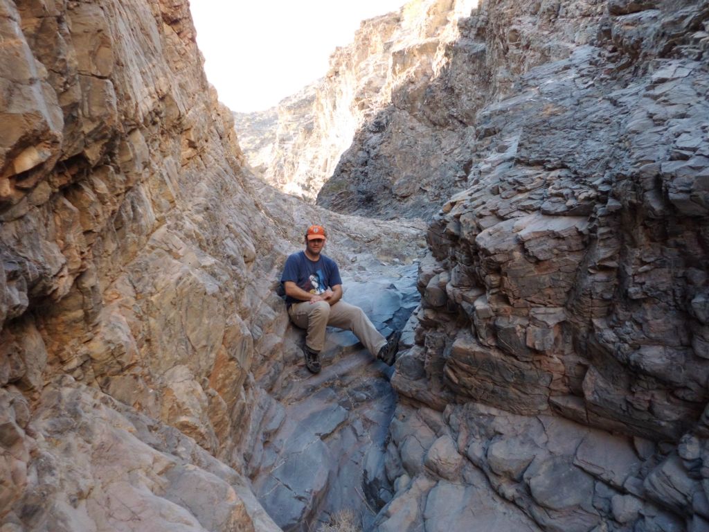 A picture of Steve sitting near the top of a basic dry fall: