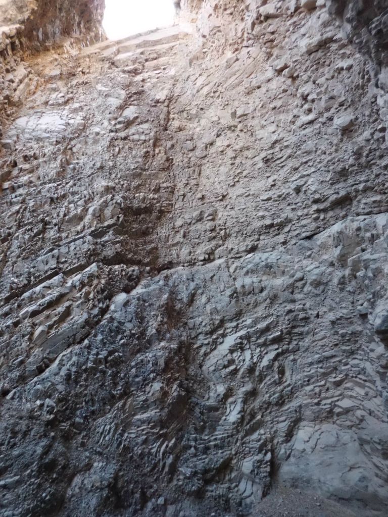 Looking up at the massive dry fall, which must have been over 50 feet high: